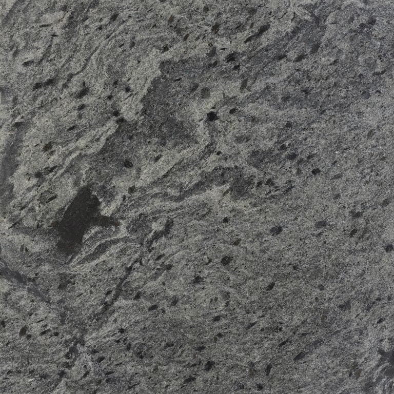 Swatch image cropped for Amazon Quartzite. The surface finish shown is honed. Dominant colors shown are green and gray; with black, brown and purple secondaries. Exhibits "movement" and the color mix creates a cool feeling. Regular, blotched and swirled color patterns. Contains mineral inclusions.