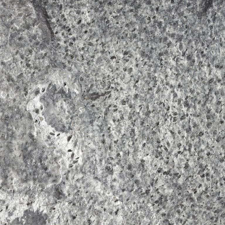 Color/Finish variation image for Amazon Quartzite. The surface finish shown is brushed. The dominant color shown is gray; with beige, green, purple and white secondaries. Exhibits "movement" and the color mix creates a cool feeling. Coarse speckled, blotched and veined color patterns. Contains some mica and mineral inclusions.