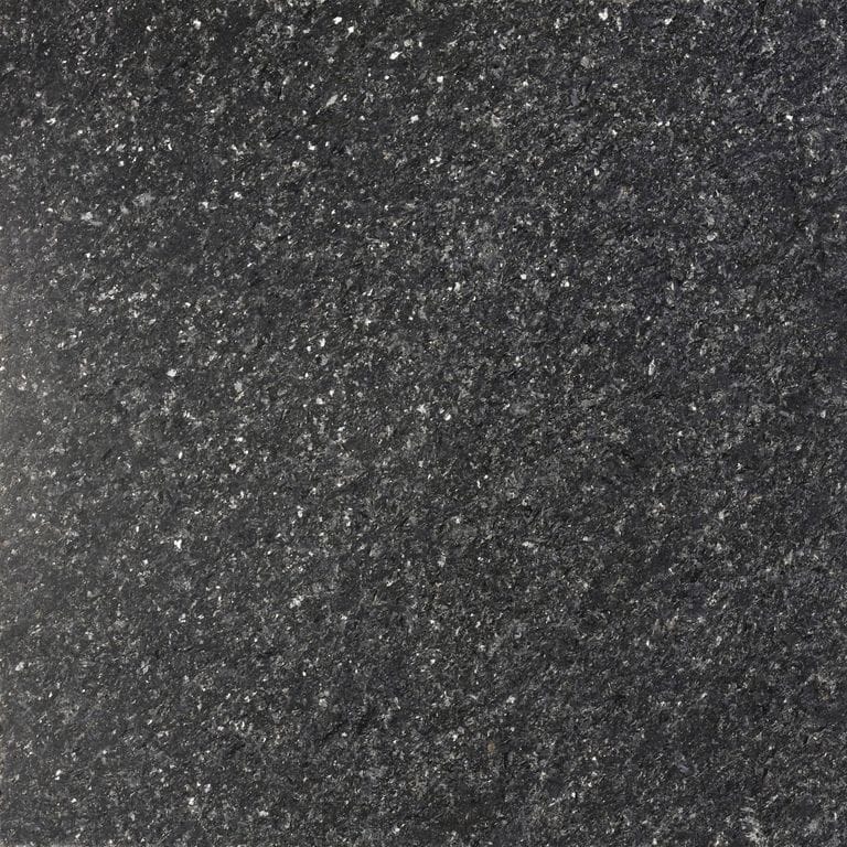 Feature image for Black Galaxy Quartzite. Dominant colors shown are black, brown and gray; with a white secondary. The color mix creates a cool feeling. Speckled color pattern.