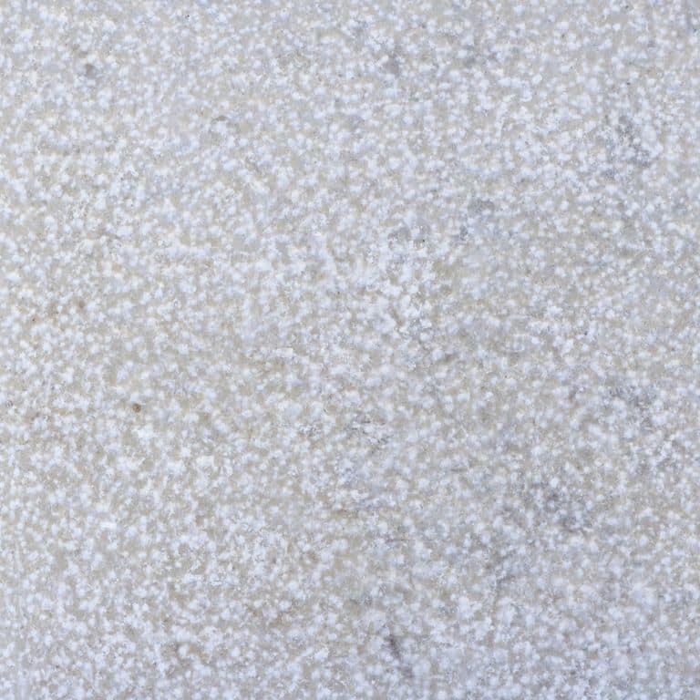 Color/Finish variation image for Amaza Limestone. The surface finish shown is a combination of brushed and bush hammered. Dominant colors shown are blue, gray and white; with a beige secondary. The color mix creates a cool feeling. Cloudy and coarse speckled color patterns.