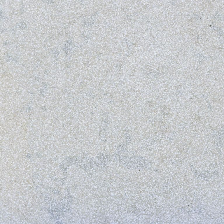 Color/Finish variation image for Amaza Limestone. The surface finish shown is a combination of brushed and sand blasted. Dominant colors shown are blue, gray and white. The color mix creates a cool feeling. Fine speckled and cloudy color patterns.