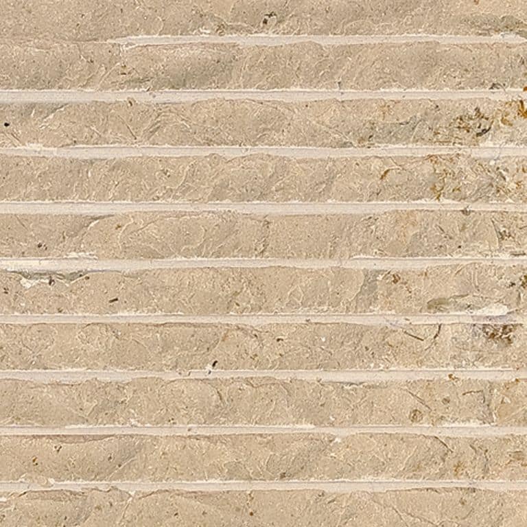 Color/Finish variation image for Cream Limestone. The surface finish shown is chiseled. Dominant colors shown are beige and tan; with brown, orange/rust and cream secondaries. Exhibits "movement" and the color mix creates a warm feeling. Linear, swirled and cloudy color patterns.