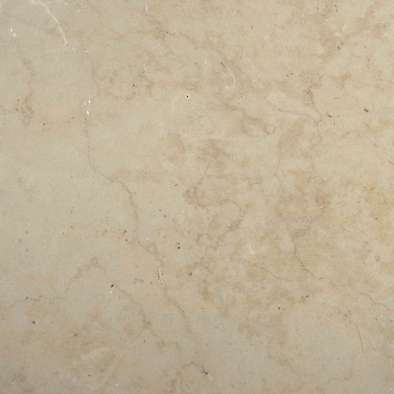 Swatch image for Limestone - Cream. The surface finish shown is honed. Dominant colors shown are beige and tan; with a brown secondary. Exhibits "movement" and the color mix creates a warm feeling. Blotched, random and cloudy color patterns. Contains mineral inclusions.