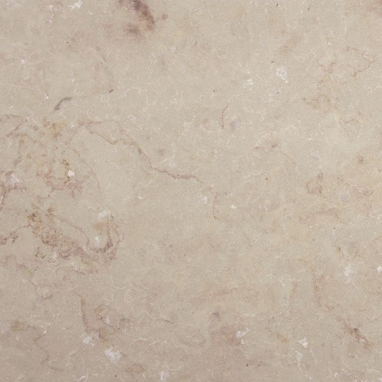 Close-up image for Cream Limestone. The surface finish shown is flamed. Dominant colors shown are beige and tan; with brown, orange/rust, pink and cream secondaries. Exhibits "movement" and the color mix creates a warm feeling. Regular, swirled and cloudy color patterns. Contains mineral inclusions.