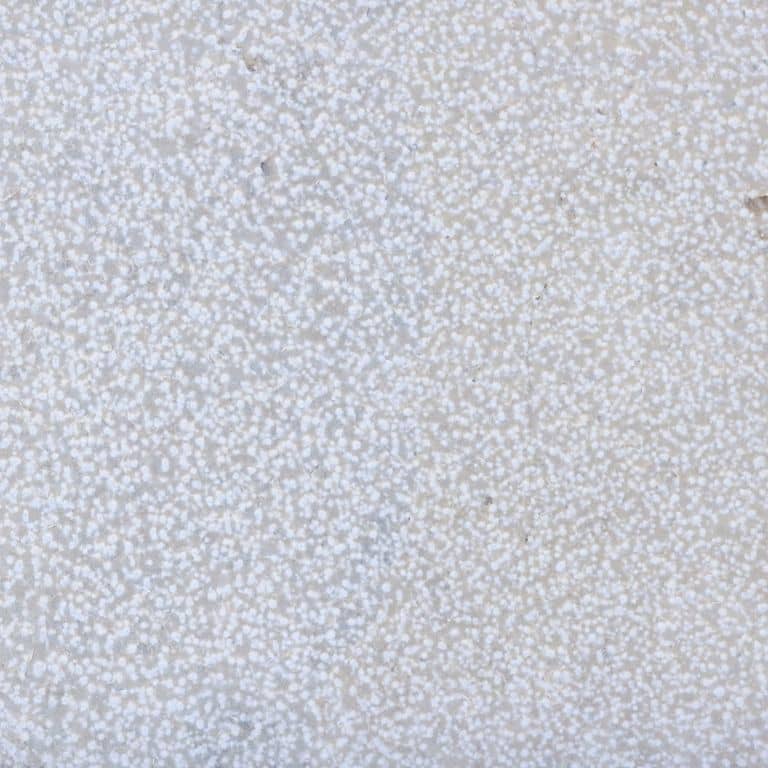 Color/Finish variation image for Valamaza Limestone. The surface finishes shown are brushed and bush hammered. Dominant colors shown are gray and white; with beige, blue, pink and purple secondaries. The color mix creates a cool feeling. Speckled and coarse speckled color patterns.