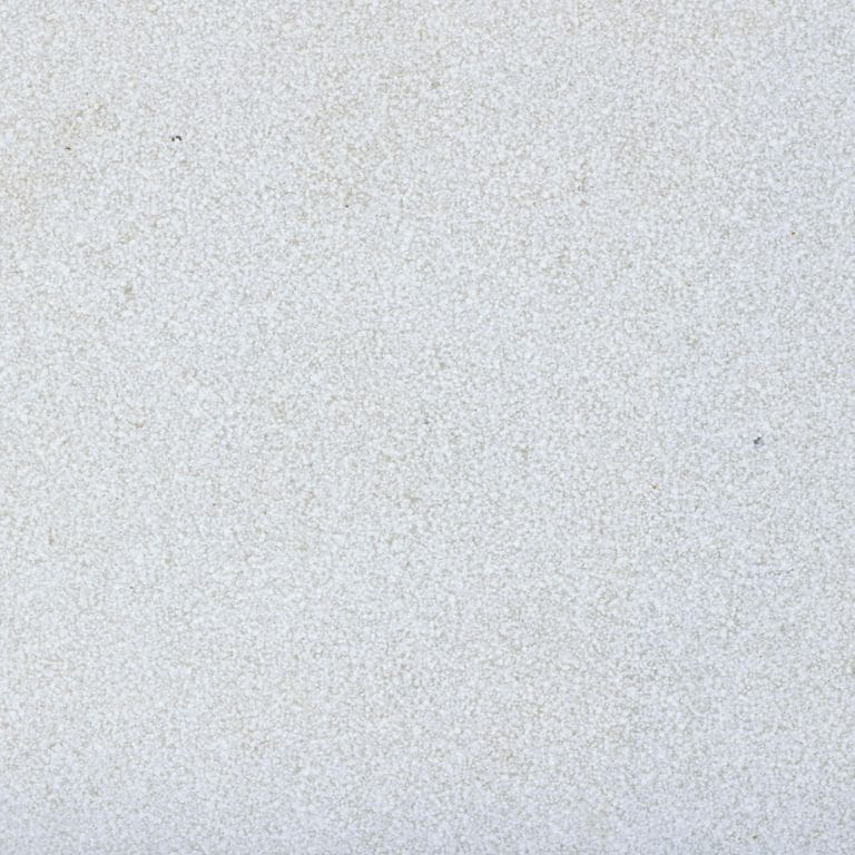 Best close-up image for Valamaza Limestone. The surface finish shown is a combination of brushed and sand blasted. Dominant colors shown are blue and gray; with beige, purple and white secondaries. The color mix creates a cool feeling. Cloudy color pattern. Contains mineral inclusions.