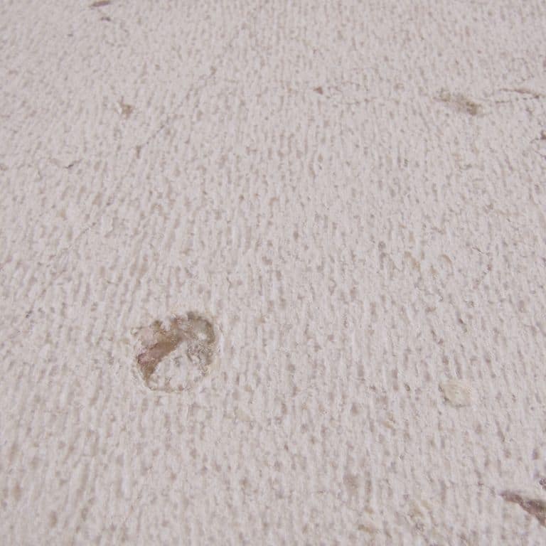 Color/Finish variation image for Limestone - Portuguese Liacado. The surface finish shown is chiseled. Dominant colors shown are beige, pink and purple; with pink, purple and white secondaries. Exhibits "movement" and the color mix creates a cool feeling. Linear, blotched and random color patterns.