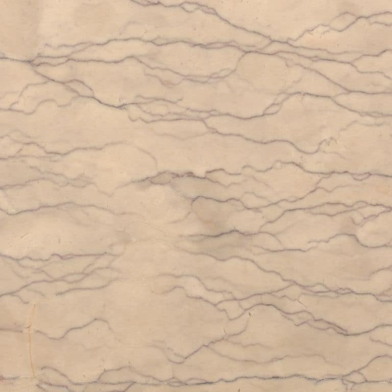 Swatch image for Limestone - Portuguese Liosin. The surface finish shown is honed. Dominant colors shown are beige, orange/rust and tan; with brown and cream secondaries. Exhibits "movement" and the color mix creates a warm feeling. Linear, veined and cloudy color patterns.
