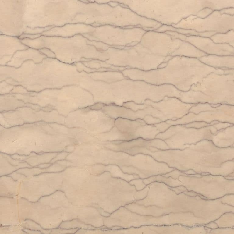 Close-up image for Liosin Limestone. The surface finish shown is honed. Dominant colors shown are beige, orange/rust and tan; with brown, pink and cream secondaries. Exhibits "movement" and the color mix creates a warm feeling. Regular, veined and linear color patterns.