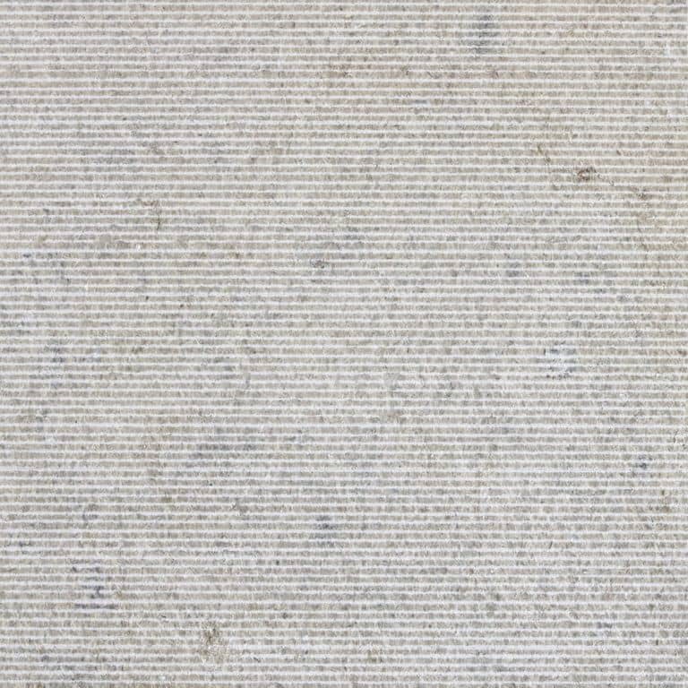 Color/Finish variation image for Classimo Sky Limestone. The surface finish shown is chiseled. The dominant color shown is gray; with beige and white secondaries. The color mix creates a cool feeling. Linear and cloudy color patterns.