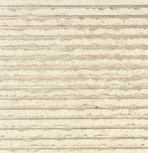 Color/Finish variation image for Royal White Limestone. The surface finish shown is chiseled. Dominant colors shown are beige, tan and cream. The color mix creates a warm feeling. Regular, linear and cloudy color patterns.
