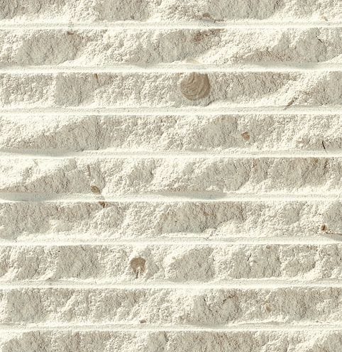 Color/Finish variation image for Imperial White Limestone. The surface finish shown is chiseled. Dominant colors shown are beige, tan and cream; with gray and white secondaries. Exhibits "movement" and the color mix creates a warm feeling. Blotched, linear and cloudy color patterns.