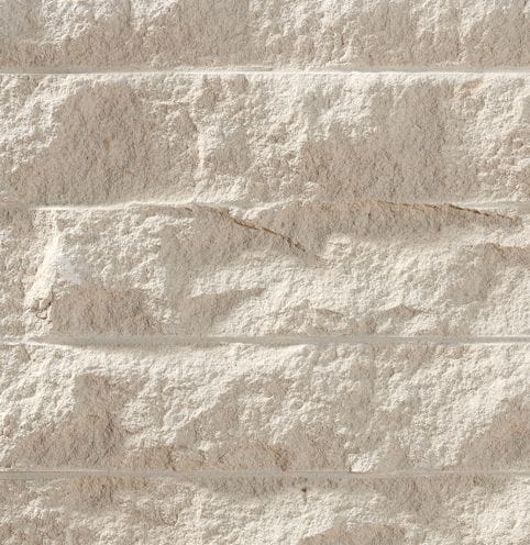 Color/Finish variation image for Sarafa Gold Limestone. The surface finish shown is chiseled. Dominant colors shown are beige and tan; with brown, gray, orange/rust, white and cream secondaries. Exhibits "movement" and the color mix creates a warm feeling. Regular color pattern.