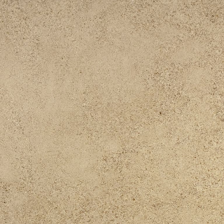 Swatch image cropped for Cremos Limestone. The surface finish shown is honed. Dominant colors shown are beige and tan; with brown and orange/rust secondaries. The color mix creates a warm feeling. Fine speckled and cloudy color patterns.