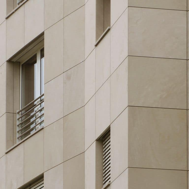 Application image for Limestone - Portuguese Cremos. The image shows this material being used for full bed veneer and window well.