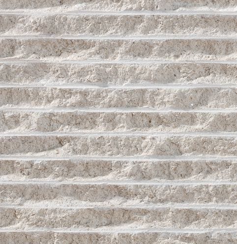 Color/Finish variation image for Cremsar Limestone. The surface finish shown is chiseled. Dominant colors shown are gray and white; with beige, pink, purple and cream secondaries. Exhibits "movement" and the color mix creates a cool feeling. Regular, linear, swirled and cloudy color patterns.
