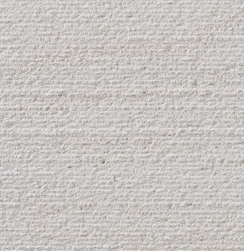 Color/Finish variation image for Cremsar Limestone. The surface finish shown is chiseled. Dominant colors shown are gray and white; with beige, pink and cream secondaries. The color mix creates a cool feeling. Regular, fine speckled and linear color patterns.