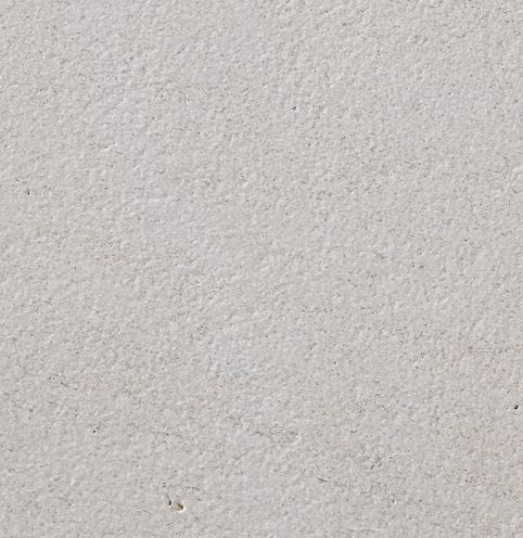 Color/Finish variation image for Cremsar Limestone. The surface finish shown is sand blasted. Dominant colors shown are beige, gray and white; with pink and purple secondaries. The color mix creates a cool feeling. Solid and fine speckled color patterns.