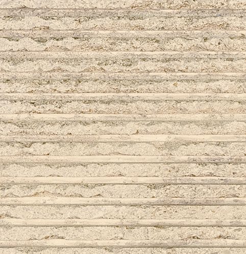 Color/Finish variation image for Cremsage Limestone. The surface finish shown is grooved. Dominant colors shown are beige and tan; with brown, orange/rust and cream secondaries. The color mix creates a warm feeling. Regular, linear and cloudy color patterns.