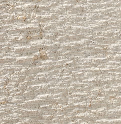 Color/Finish variation image for Cremcar Limestone. The surface finish shown is chiseled. Dominant colors shown are beige and tan; with brown, gray, white and cream secondaries. The color mix creates a warm feeling. Regular, linear and cloudy color patterns.