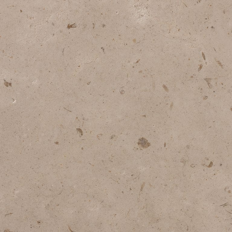 Close-up image for Cremcar Limestone. The surface finish shown is honed. Dominant colors shown are brown and tan; with beige, gray, orange/rust and pink secondaries. The color mix creates a warm feeling. Regular and blotched color patterns.
