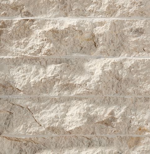 Color/Finish variation image for Coralau Limestone. The surface finish shown is chiseled. Dominant colors shown are beige and tan; with brown, gray, orange/rust and cream secondaries. Exhibits "movement" and the color mix creates a warm feeling. Regular, linear, swirled and cloudy color patterns.