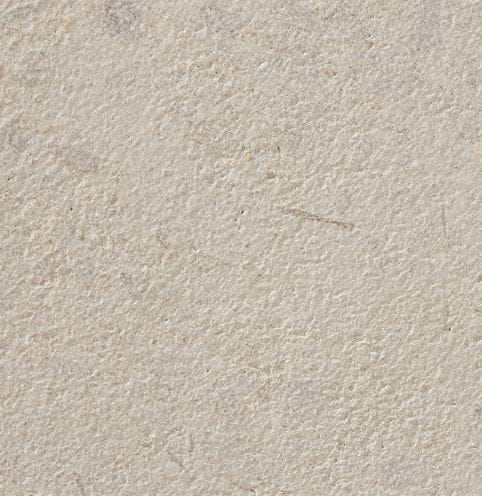 Color/Finish variation image for Coralau Limestone. The surface finishes shown are brushed and sand blasted. The dominant color shown is beige; with gray, white, tan and cream secondaries. The color mix creates a warm feeling. Regular and cloudy color patterns.