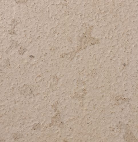 Color/Finish variation image for Portuguese Pacific Beige Limestone. The surface finish shown is brushed. The dominant color shown is tan; with beige, gray and orange/rust secondaries. The color mix creates a warm feeling. Blotched and random color patterns.