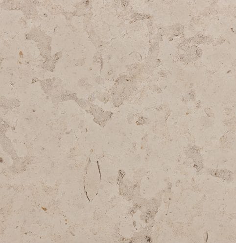 Color/Finish variation image for Portuguese Pacific Beige Limestone. The surface finish shown is honed. The dominant color shown is tan; with brown and pink secondaries. Exhibits "movement" and the color mix creates a warm feeling. Swirled and blotched color patterns.
