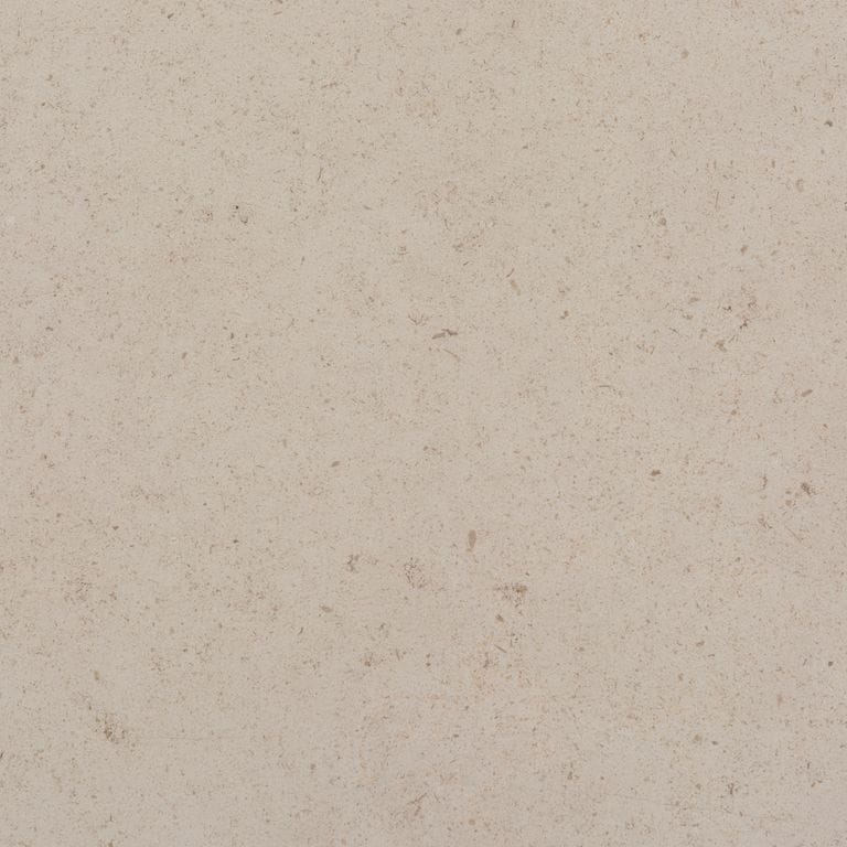 Close-up image for Classic White Limestone. The surface finish shown is honed. Dominant colors shown are beige and tan; with brown, gray and pink secondaries. The color mix creates a warm feeling. Solid color pattern.