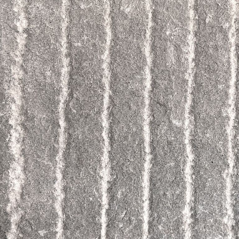 Color/Finish variation image for Italian Bluestone. The surface finish shown is grooved. The dominant color shown is gray; with a green secondary. The color mix creates a cool feeling. Regular and linear color patterns.