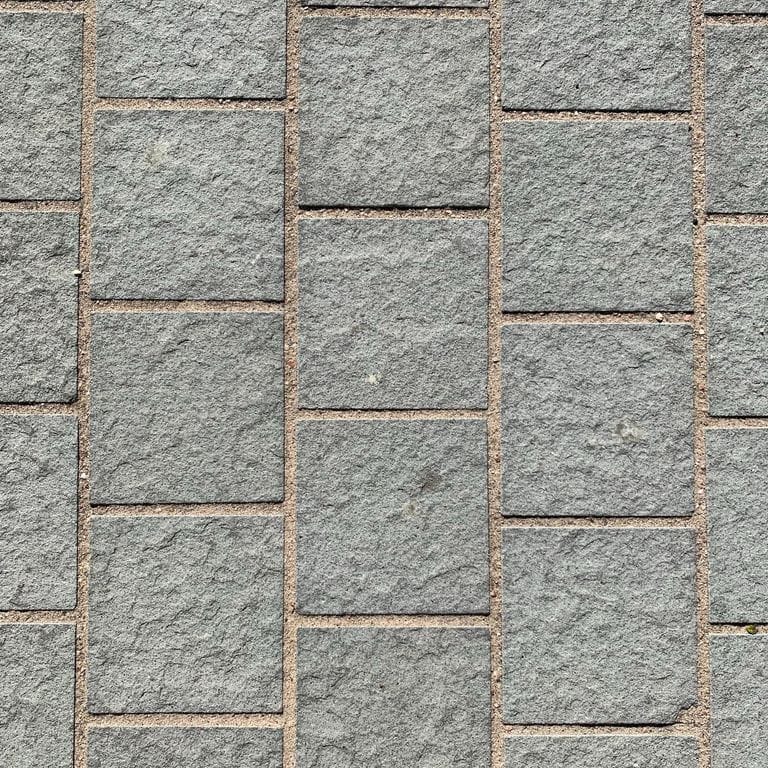 The image shows this material being used for driveway pavers, path pavers and patio pavers.