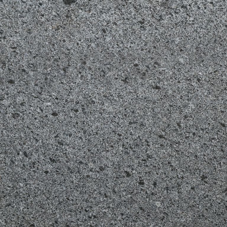 Color/Finish variation image for Republic Black Granite. The surface finish shown is flamed. Dominant colors shown are black and gray. The color mix creates a cool feeling.
