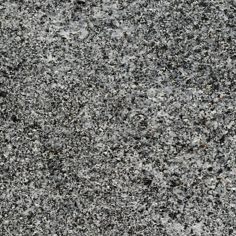 Color/Finish variation image for Republic Black Granite. The surface finish shown is flamed. Dominant colors shown are black and gray; with green and white secondaries. Exhibits "movement" and the color mix creates a cool feeling. Speckled color pattern.