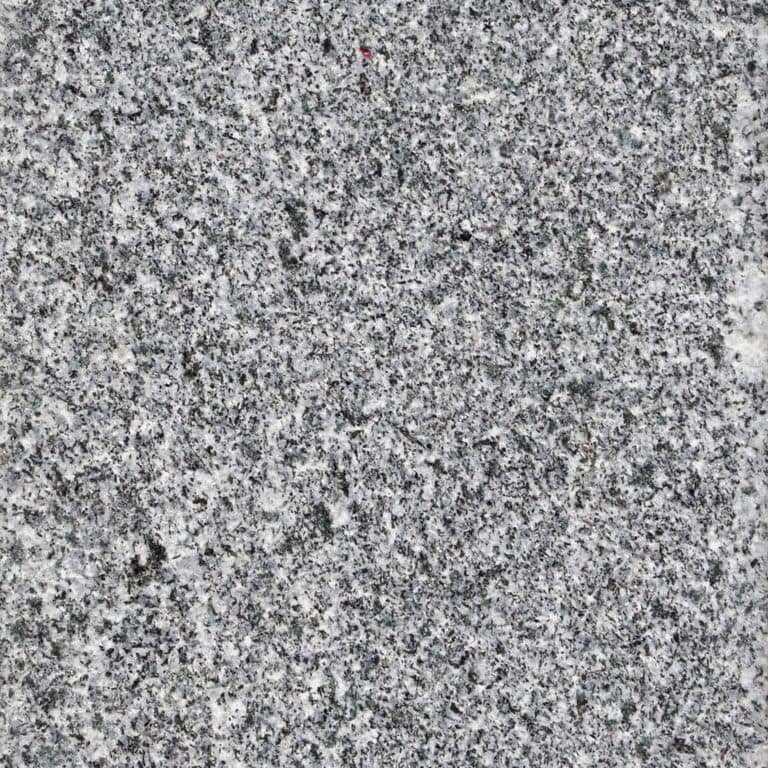 Close-up image for Republic Black Granite. The surface finish shown is sand blasted. The dominant color shown is gray; with a white secondary. The color mix creates a cool feeling. Speckled color pattern. Contains some mica.