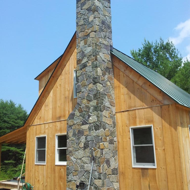 The image shows this material being used in a chimney application.
