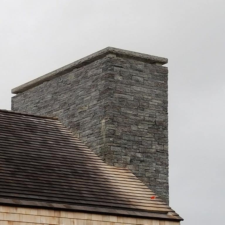 The image shows this material being used in a chimney application.