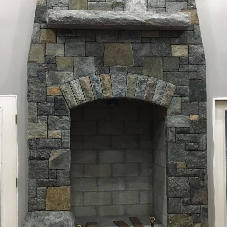 The image shows this material being used for fireplace surround and thin veneer.
