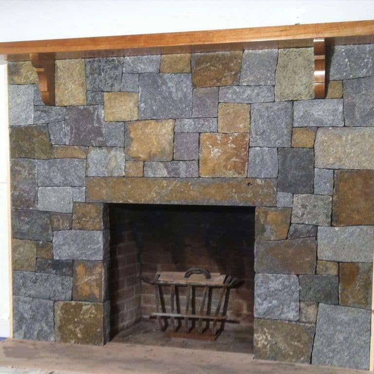 Application image for Granite - Lake George. The image shows this material being used for fireplace surround, thin veneer and interior cladding.