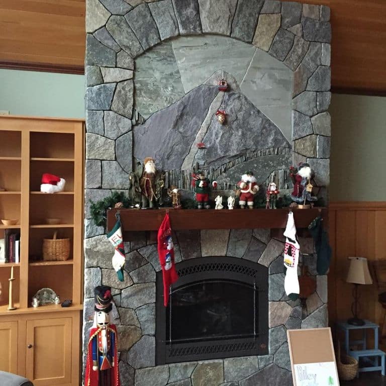 Application image for Granite - Lake George. The image shows this material being used for fireplace surround, thin veneer and interior cladding.
