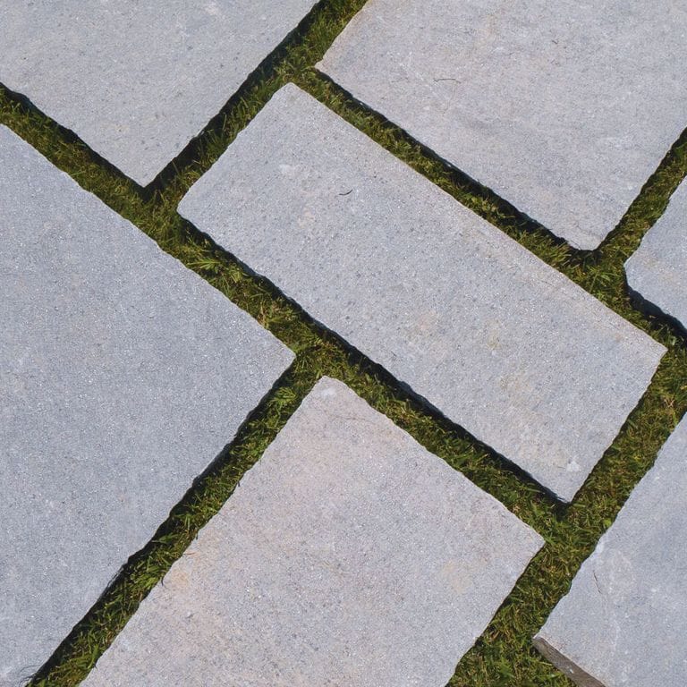The image shows this material being used for path pavers and patio pavers.