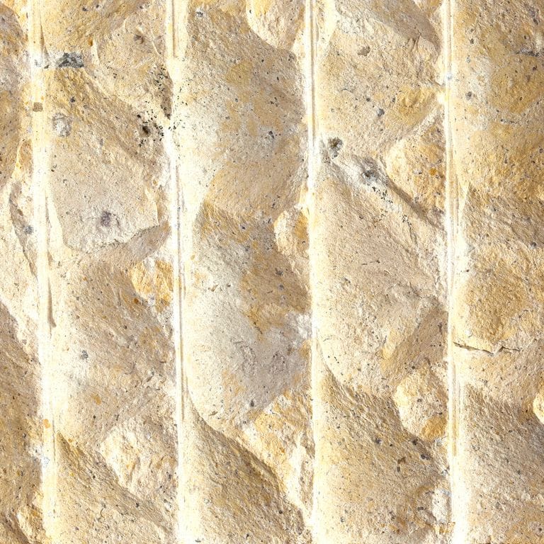 Color/Finish variation image for China Buff Sandstone. The surface finish shown is grooved. Dominant colors shown are beige, yellow, tan and cream; with orange/rust and white secondaries. Exhibits "movement" and the color mix creates a warm feeling. Random color pattern.