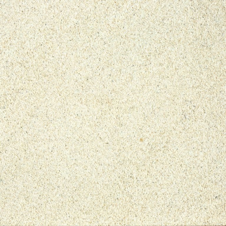Close-up image for China Buff Sandstone. The surface finish shown is sand blasted. Dominant colors shown are beige and cream; with white and yellow secondaries. The color mix creates a warm feeling. Solid and fine speckled color patterns.