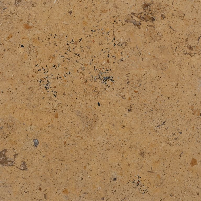 Color/Finish variation image for China Buff Limestone. The surface finish shown is honed. Dominant colors shown are brown, orange/rust and tan. The color mix creates a warm feeling.