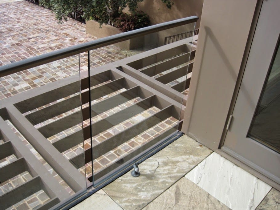 The image shows this material being used in a patio pavers application.