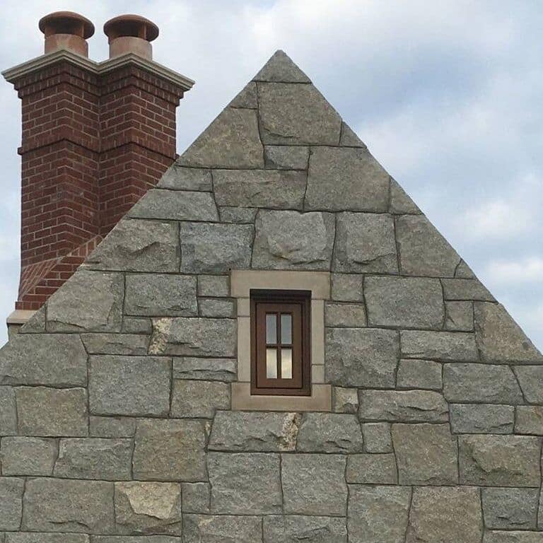 Application image for Granite - Dusty Rose. The image shows this material being used for full bed veneer and thin veneer.