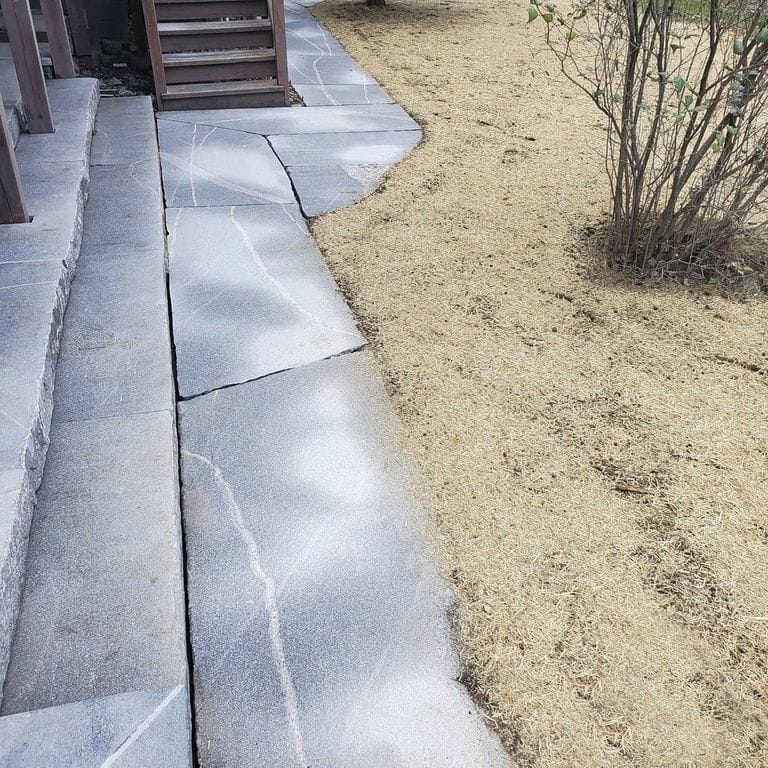 The image shows this material being used for path pavers and monolithic steps.