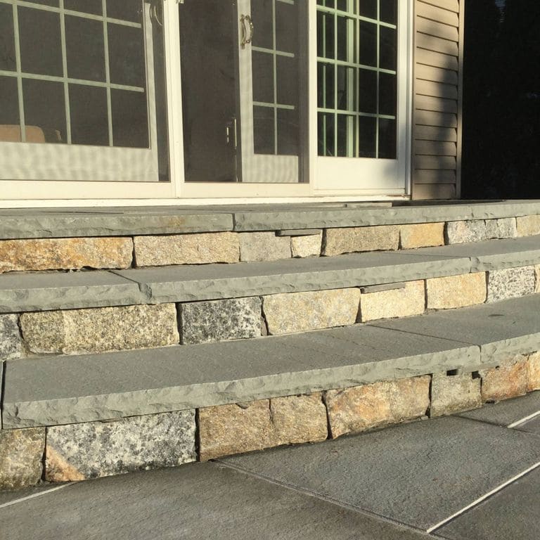 Application image for Connecticut Granite Blend - Thin Veneer. The image shows this material being used in a treads application.