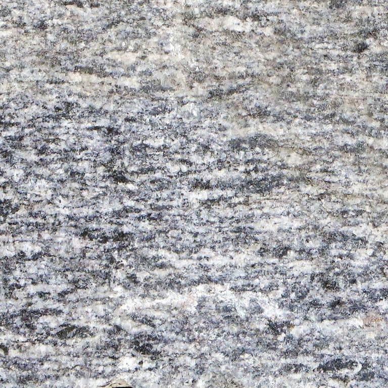 The surface finish shown is . The dominant color shown is gray. The color mix creates a cool feeling. Coarse speckled and streaked color patterns.
