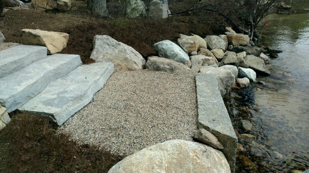 Application image for Liberty Hill Granite. The image shows this material being used in a monolithic steps application. This is a building and landscape stone for indoor and outdoor commercial and residential applications. Suitable for general use, freeze-thaw conditions and low slipperiness surfaces situations. Relatively moderate in price.